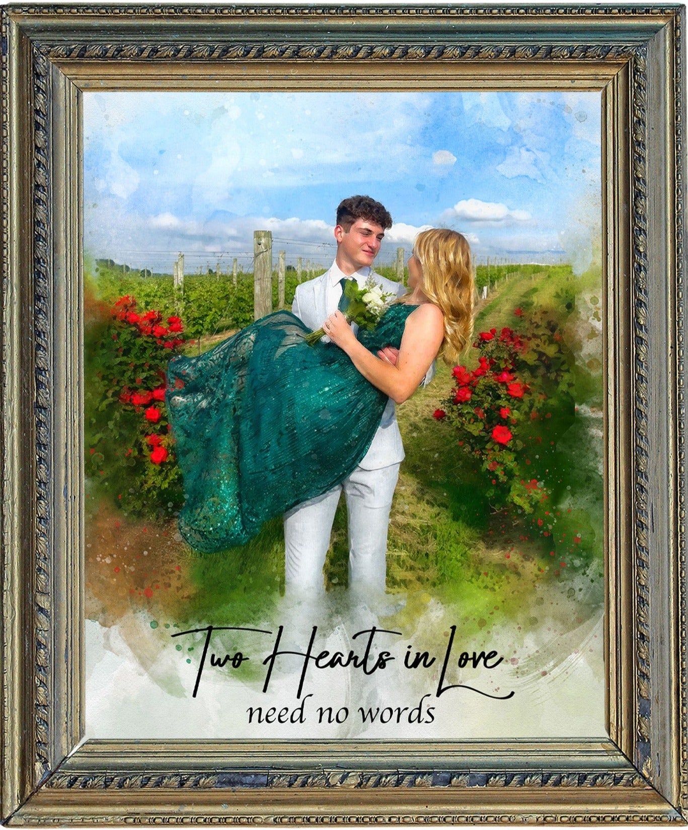 A romantic country wedding portrait painting in a rustic frame shows a groom in a white suit carrying his bride in a sparkly green dress through a farm wedding vineyard. Red flowers bloom on bushes flanking a path, and green foliage extends into the background under a blue sky. The text "Two Hearts in Love need no words" is at the bottom. This rustic wedding gift could be a barn wedding portrait from a cherished photo