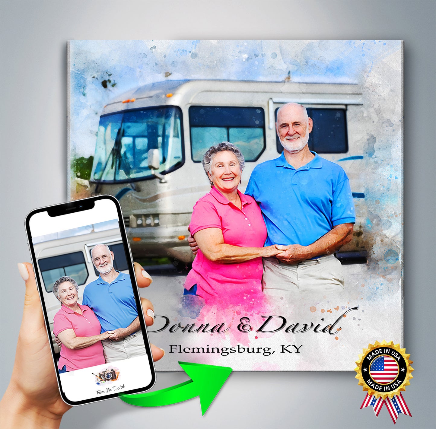 Canvas print of a couple in front of an RV with personalized text, held by a hand with a phone.